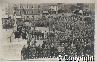 Postcard: black and white photograph of military ceremony [award of medals?] in a market square, possibly Retford