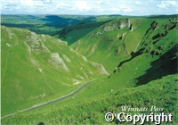 Postcard featuring a coloured photograph of the road through Winnats Pass in the Peak District
