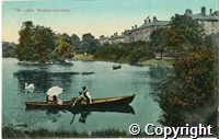 Postcard featuring a coloured print of boaters on the lake in Pavilion Gardens.