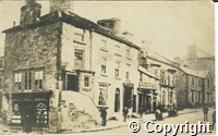 Postcard featuring a black and white photograph of the building on corner of Spring Gardens and Terrace Road, Buxton (now NatWest Bank)