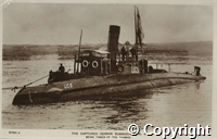 Postcard: the captured German Submarine U.C. 5 being towed up the Thames