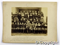 Black and white photograph of a group mainly children and young people employed by Belper mills